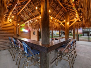 Your own private tiki bar—complete with bar seating, party lights, and serious island vibes.
