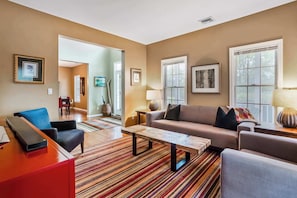 Bright, comfy living room to unwind after exploring