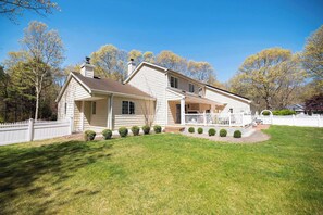 Charming fenced-in home with spacious yard and sunny vibes.