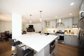 Modern kitchen with sleek finishes and a spacious island. 