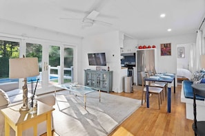 Open-concept living room, dining space, and kitchen.