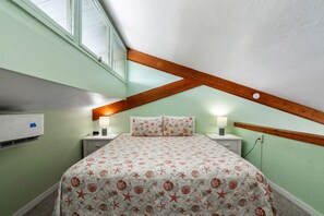 King bed in the open loft bedroom area