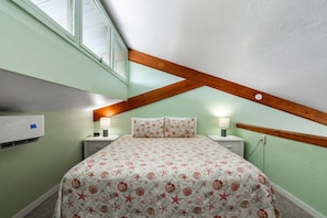 King bed in the open loft bedroom area