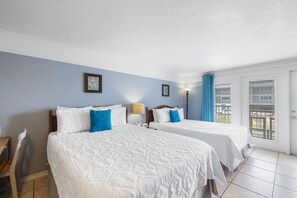 Two queen beds in this well appointed studio condo in downtown Cedar Key
