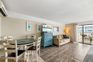 Dining for 4, large smart TV, clothing storage and sofa