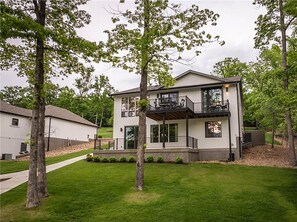 Two decks on the back of the house provide plenty of lake views and good times.