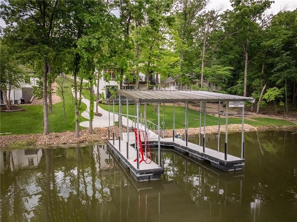 Private dock with its own beach. Walk right in the water and float around.