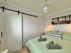 Double bedroom with rural views and sliding door
