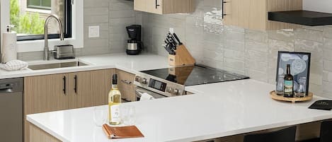 Step into a spacious, well-lit kitchen equipped with everything you need for gourmet cooking and entertaining.