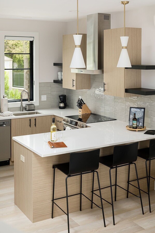 Step into a spacious, well-lit kitchen equipped with everything you need for gourmet cooking and entertaining.