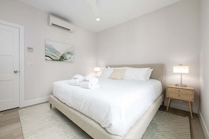 Enjoy a restful retreat in this bedroom, featuring a queen-sized bed, cozy ambiance, and plenty of natural light
