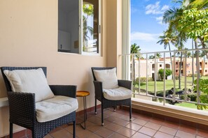 Ideal for sipping morning coffee or enjoying a sunset cocktail, this inviting scene creates a serene escape right at home. Embrace relaxation and coastal vibes with this delightful addition to your balcony.