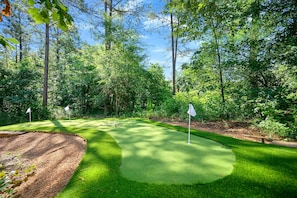 And wait — there’s more! This incredible backyard also features a putt-putt course to complete the experience.