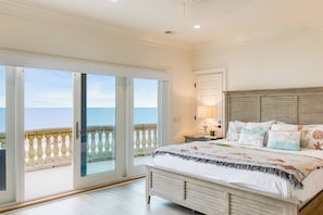 The third-floor master bedroom features a king bed, single pull-out sofa, ensuite bathroom, balcony access, and stunning ocean views.