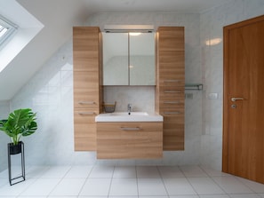 Flooring, Bathroom Sink, Bathroom Cabinet, Wood, Interior Design, Floor, Cabinetry, Sink, Plumbing Fixture, Bathroom