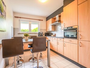 Kitchen, Furniture, Interior Design, Cabinetry, Countertop, Kitchen Appliance, Flooring, Major Appliance, Drawer, Home
