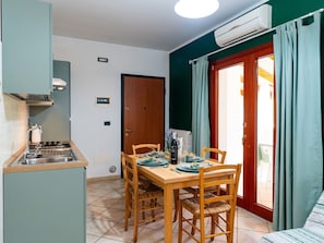 Interior Design, Room, Apartment, Wood Stain, Hardwood, Chair, Houseplant, Kitchen & Dining Room Table