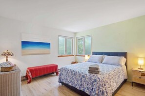 Colorful bedroom with ocean-themed artwork