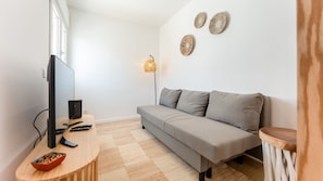 A cozy living room with a plush sofa and a flat-screen TV, offering the perfect space for relaxation after a day of exploration.
#LivingRoomVibes #CozyLiving #AlbufeiraStay #ModernDesign #OpenSpace #RelaxationTime #StylishLiving