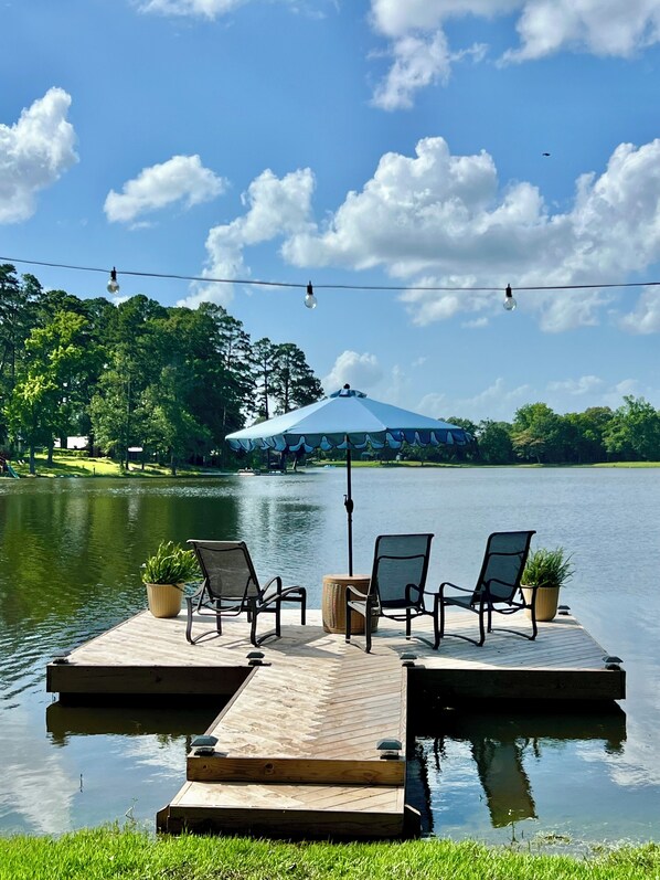Pier and sun loungers for relaxing or fishing.