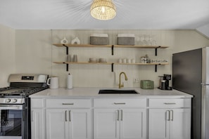 Fully stocked kitchen with Keurig, toaster, microwave & more