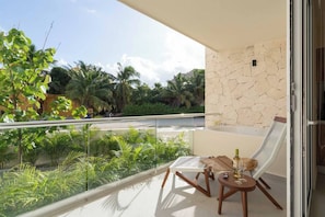 Relax on your private patio with a soothing hot tub, where you can unwind and soak in the ocean breeze throughout your stay.