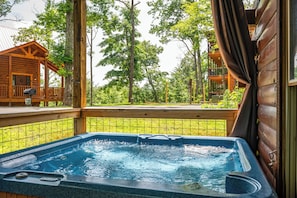 Enjoying relaxing in our hot tub. (Privacy curtains provided).