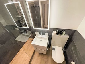 Flooring, Floor, Interior Design, Plumbing Fixture, Bathroom, Bathroom Sink, Bathroom Cabinet, Toilet, Sink, Plumbing