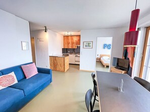 Furniture, Interior Design, Flooring, Floor, Wood, Ceiling, Room, Couch, Table, Lighting