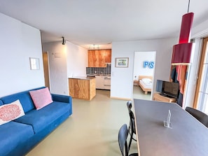 Furniture, Interior Design, Flooring, Floor, Wood, Ceiling, Room, Couch, Table, Lighting
