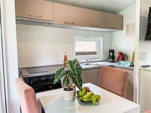 Interior Design, Furniture, Flooring, Countertop, Floor, Kitchen, Major Appliance, Wood Stain, Kitchen & Dining Room Table, Kitchen Appliance
