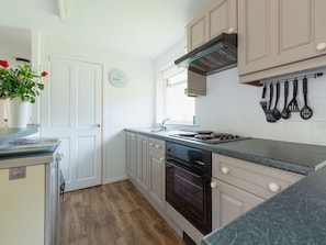 Kitchen, Countertop, Kitchen Appliance, Cabinetry, Major Appliance, Interior Design, Furniture, Wood, Flooring, Kitchen Sink