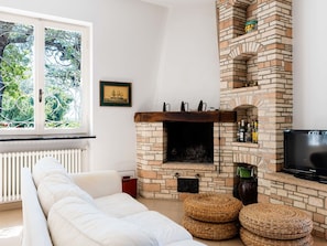 Furniture, Interior Design, Wall, Flooring, Wood, Living Room, Room, Floor, Hearth, Couch