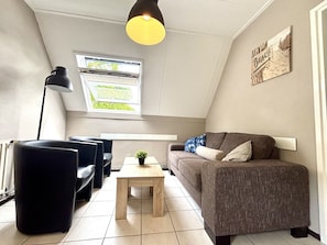 Furniture, Interior Design, Flooring, Wall, Couch, Floor, Ceiling, Wood, Room, Living Room