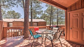 The deck will accommodate 6, has a gas grill, table, chairs and a mini fridge