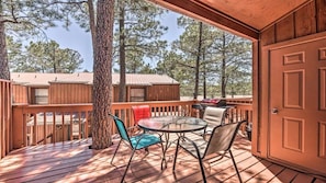 The deck will accommodate 6, has a gas grill, table, chairs and a mini fridge