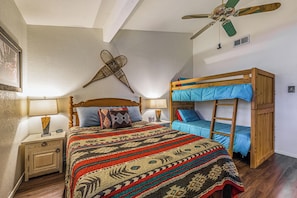 Bedroom 1 has a queen bed and 2 bunk beds.
