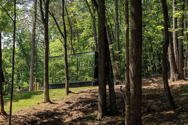 Surrounded by towering trees and total tranquility—this mirrored retreat offers couples a one-of-a-kind escape into the heart of the woods.