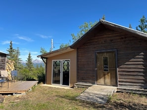 Bedroom is on the right; Alaskan kitchen on the left with sliding glass window.
