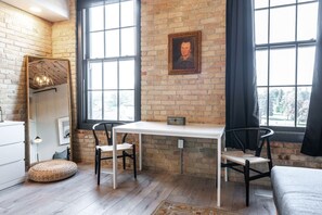 Admire original Edwardian‑style architectural details like wooden beams and channeled brick—preserved since 1903 at Bradshaw Lofts.