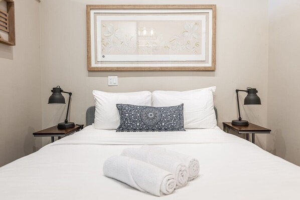 Tranquil bedroom suite in a heritage‑converted Mooney Biscuit factory, perfect after an evening at Stratford Festival or Avon Theatre.