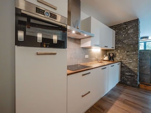 Countertop, Kitchen, Cabinetry, Interior Design, Kitchen Appliance, Major Appliance, Wood, Flooring, Home Appliance, Room