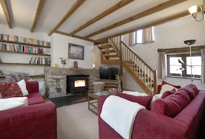 The Linhay, Noss Mayo. Ground Floor: The cosy sitting room offers comfortable sofas, a television and warming wood-burning stove