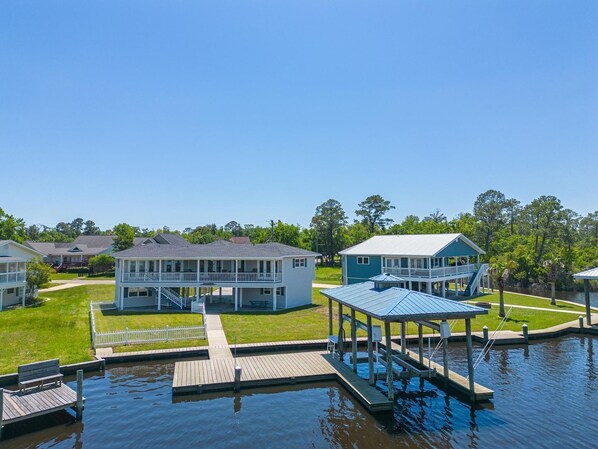 Experience the charm of this waterfront vacation rental with a private dock and beautifully landscaped grounds in Gulfport, MS.