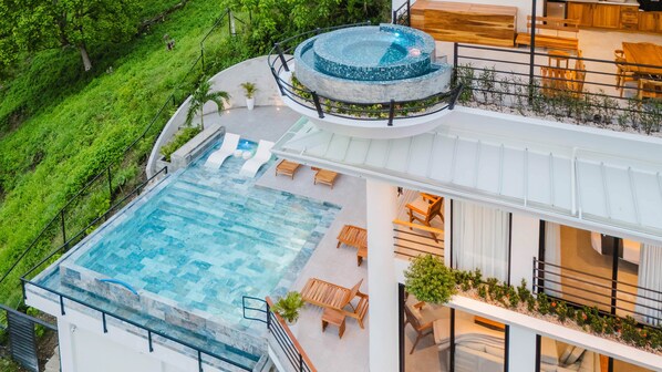 Casa Vistas Infinitas—ocean views, open-air living, and a glowing infinity pool.