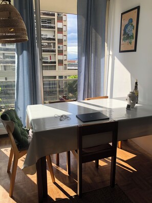 Dining table with a view on gardens and canal