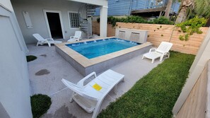 Pool view with staircase to the 2nd floor and entrance to the extra open space 