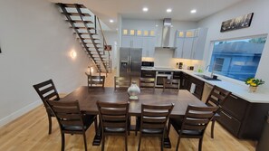 Living room, staircase, kitchen, Dining table sits 10 people