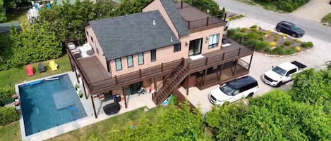 Drone shot ! Side of house with double deck balcony ! Backyard view with pool !