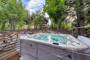Relax and unwind in your private hot tub.